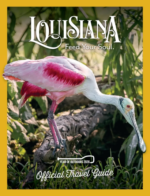 Louisiana Travel Guide: A scenic view of a Louisiana bayou with cypress trees and Spanish moss reflecting in the water at sunset.