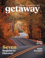 New Hampshire Vacation Guide: A scenic view of the White Mountains in New Hampshire during the autumn season with vibrant orange and red foliage.