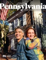 Pennsylvania Vacation Guide: A scenic view of historic Philadelphia buildings and green spaces during a clear autumn day.