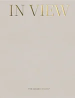 The Shade Store Catalog: Elegant custom window shades in a brightly lit modern living room.