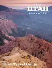 Scenic view of Utah red rocks and sandstone arches under a blue sky.