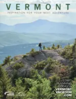 Vermont Vacation Guide: A scenic view of a Vermont landscape featuring a historic white church and colorful autumn trees.