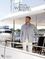 Westport Big & Tall Catalog: A well-dressed man wearing a high-quality navy blazer and light-colored trousers from the big and tall collection.